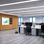 **

> A modern office interior with LED lighting, smart HVAC controls, and employees participating in an energy-saving training session. Focus on energy efficiency and employee engagement.

**